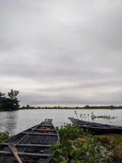 Two boats in a flooded field.